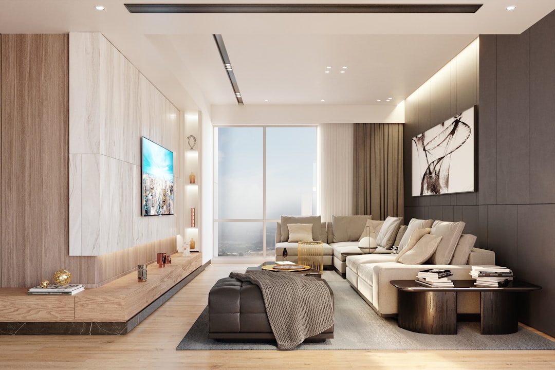 Beautifully staged luxury living room with modern furniture and neutral tones, filled with bright, natural light, showcasi...